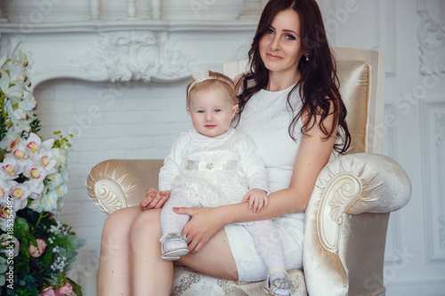Happy loving family. Mother and her daughter child girl playing and hugging.