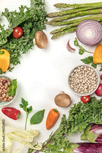 Vibrant fresh vegetables, cereals, and mushrooms on white background with copyspace