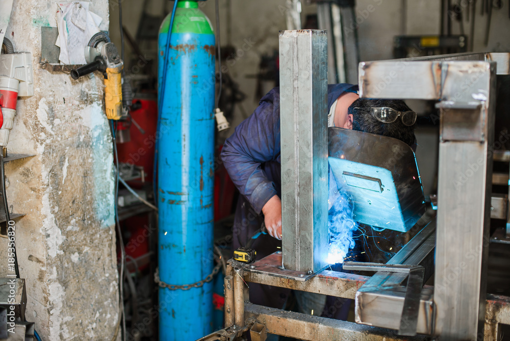 Professional welder in working process Professional welder in working process