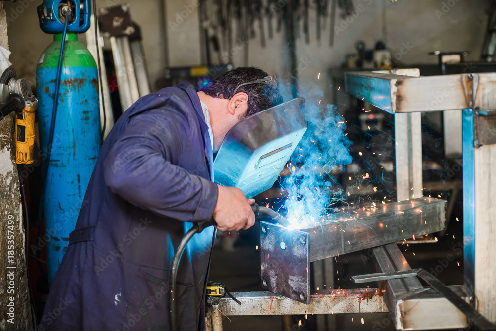 Professional welder in working process Professional welder in working process