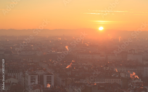 Smoke plumes and air pollution over the french city of Lyon during sunrise.