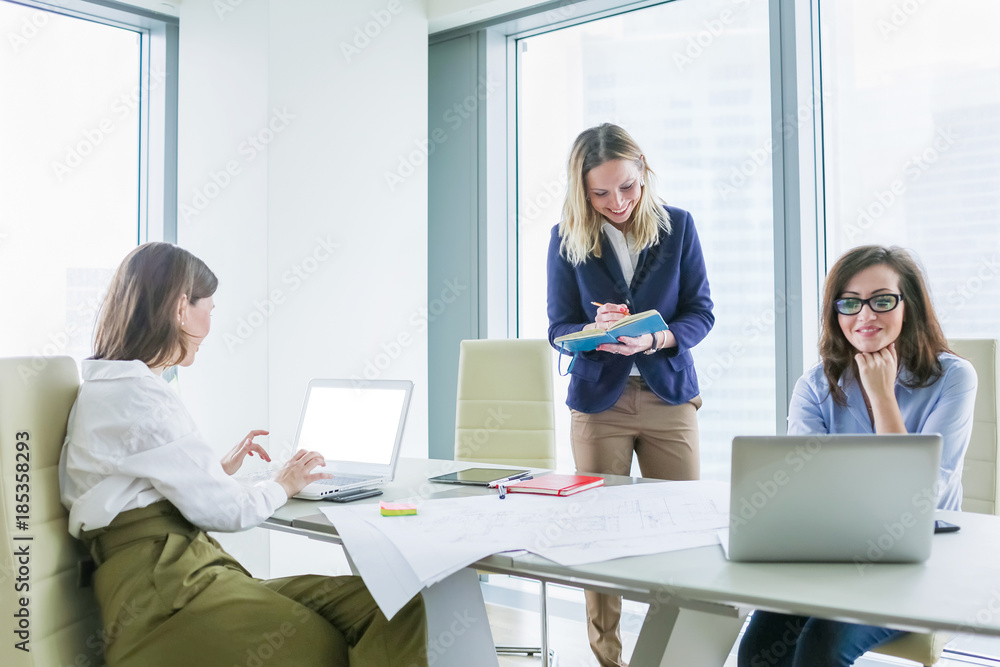 Happy business women working at office Happy business women working at office