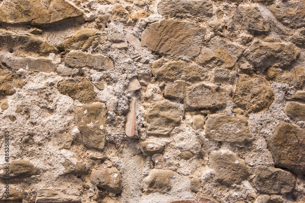 Stone wall background and ancient tuff, Tuscany in Italy Stone wall background and ancient tuff, Tuscany in Italy