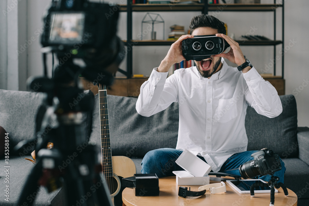 surprised technology blogger testing virtual reality headset surprised technology blogger testing virtual reality headset