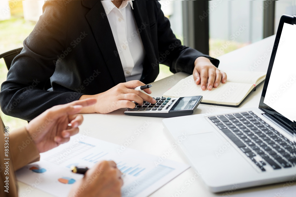 Administrator business man financial inspector and secretary making report, calculating balance. Internal Revenue Service checking document. Audit concept.