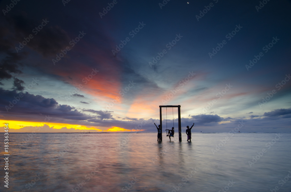 amazing sunset view at gili trawangan, lombok island, indonesia amazing sunset view at gili trawangan, lombok island, indonesia