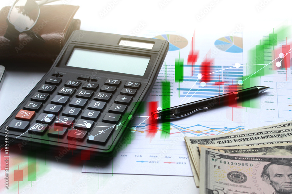 Double exposure of business Calculator and pen and Dollar money with stock market or financial graph for financial investment and trading concept Double exposure of business Calculator and pen and Dollar money with stock market or financial graph for financial investment and trading concept