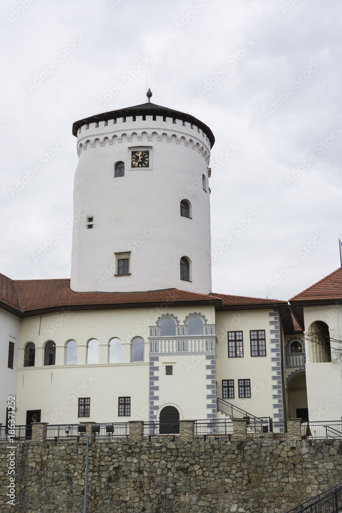 Tower and castle with cloudy sky in the background. Tower and castle with cloudy sky in the background.