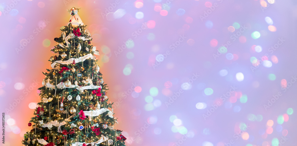 Decorated christmas tree against wide background Decorated christmas tree against wide background