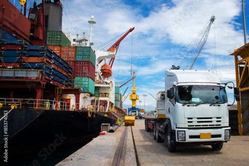 delivery and transit cargo units of container from yard to the ship vessel loading in port terminal by trucking of lorry, the logistics system services to global worldwide transportation CONCEPT