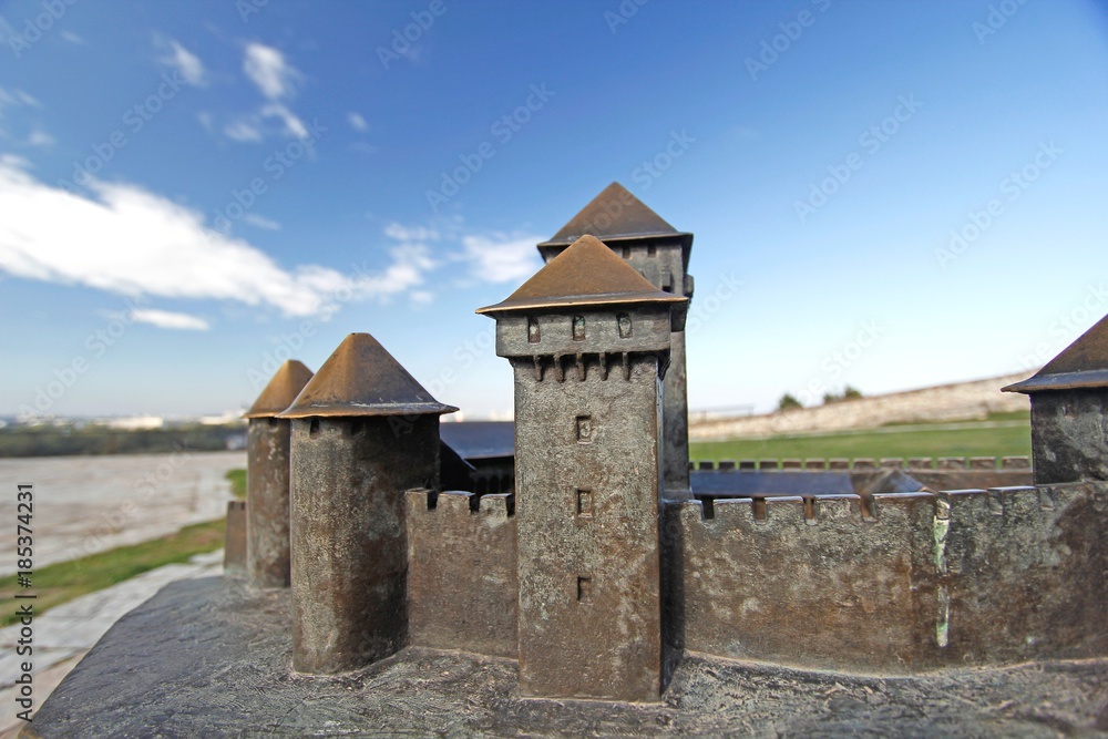 Model of a medieval military fortress with guard towers and walls Model of a medieval military fortress with guard towers and walls