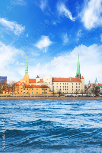 Beautiful view of Riga Castle and St. Peter's Cathedral across the Daugava River in Riga, Latvia