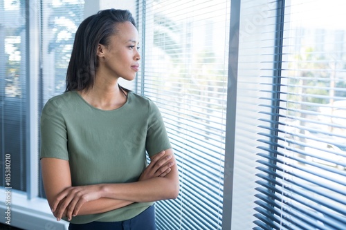 Free Download Female executives looking through window in office - GFXLoad