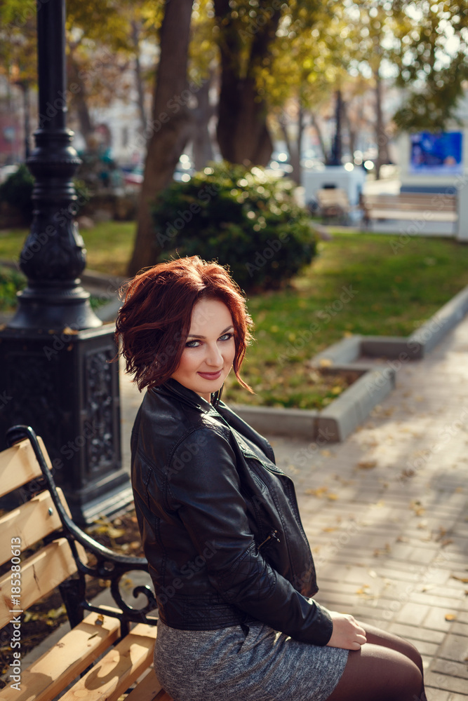 Young stylish woman wearing black coat 