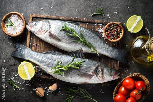 Photography Fresh fish seabass on black.