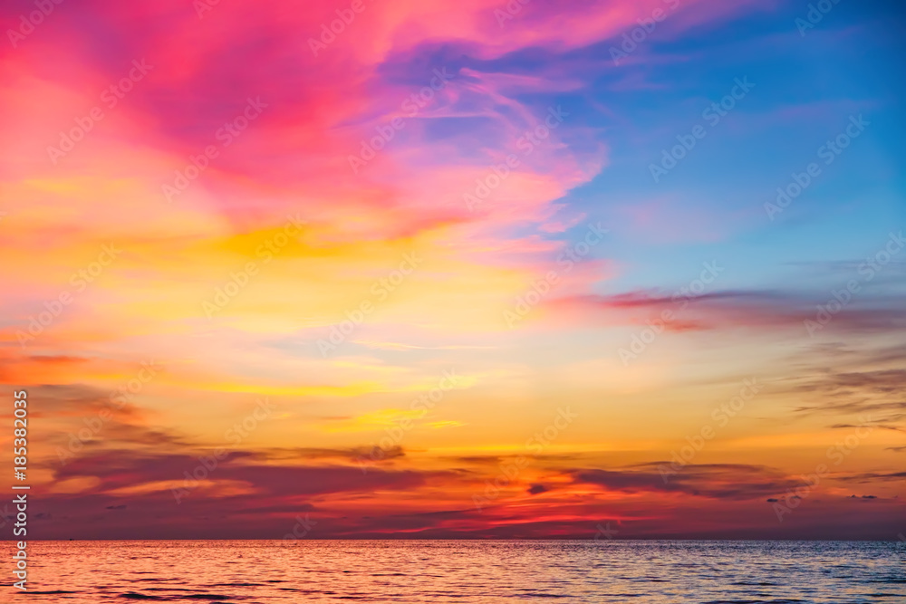 Tropical colorful dramatic sunset with cloudy sky . Evening calm on the Gulf of Thailand. Bright afterglow.
