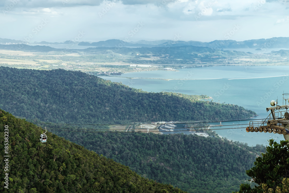 Panoramic view of blue sky, sea and mountain seen from Cable Car viewpoint, Langkawi, Malaysia. Picturesque landscape with tropical forest, beaches, small Islands in waters of Strait of Malacca