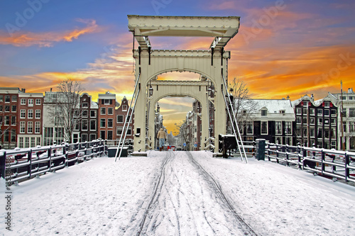 Photography Snowy tiny bridge in Amsterdam the Netherlands in winter at sunset
