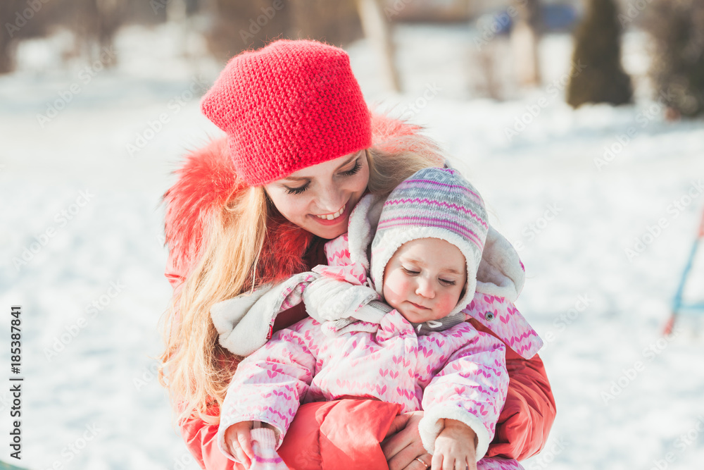 Portrait of mother and daughter in winter