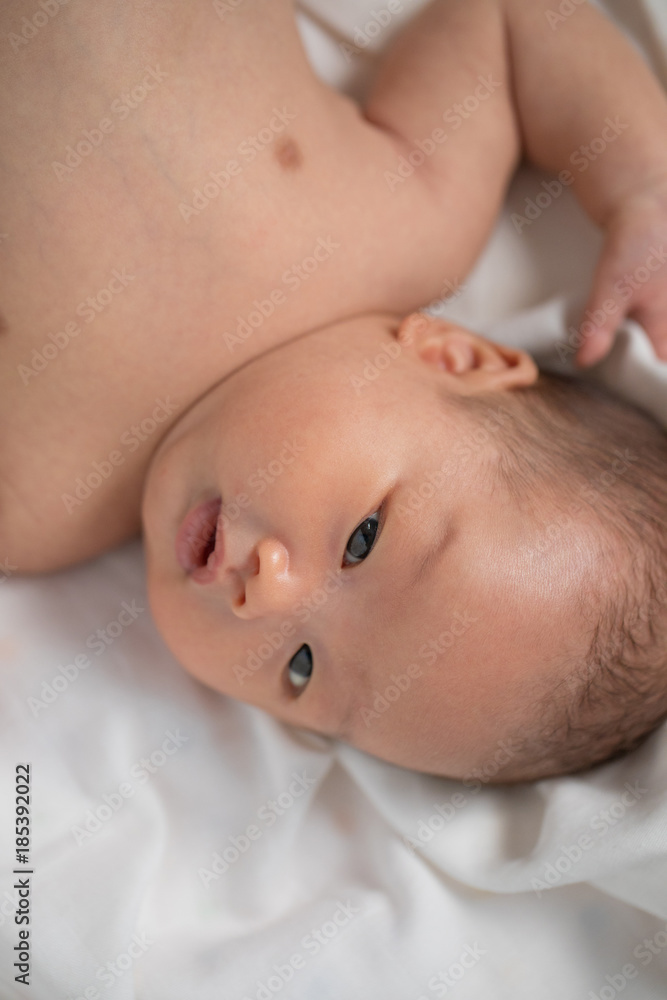 Asian new born baby boy smiling. Asian new born baby boy smiling.