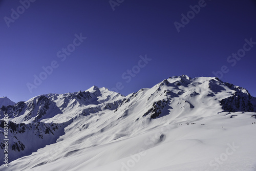 Snow capped mountain peaks, enroute Sarpass trek in Himachal Pradesh, India photo