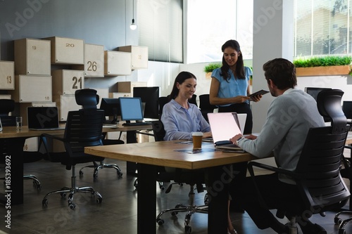 Executive working on laptop at desk