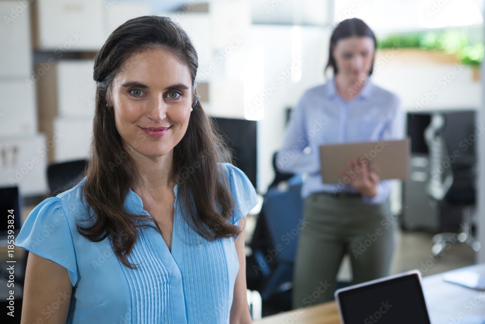 Female executive looking into camera in the office Female executive looking into camera in the office