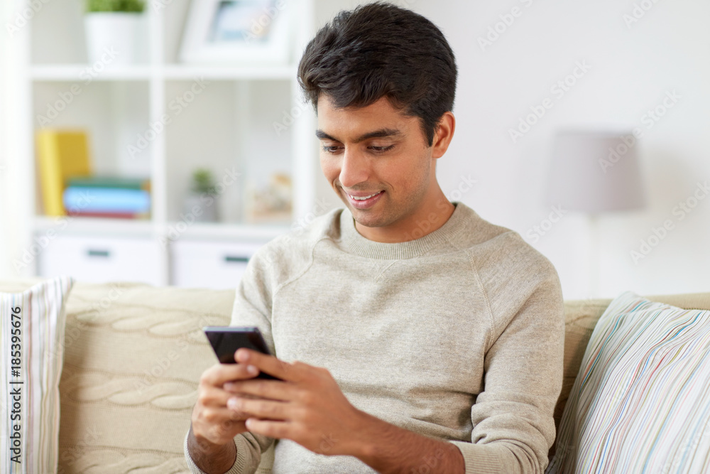 happy man with smartphone at home happy man with smartphone at home