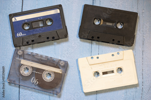 Old cassette tapes with a wooden background