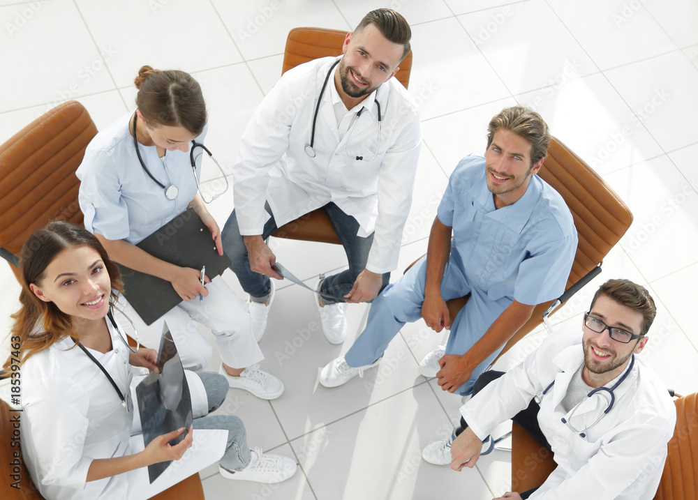 Fototapeta premium medical staff discussing current issues,sitting behind a Desk