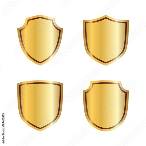 Gold shield shape icons set. 3D golden emblem signs isolated on white background. Symbol of security, power, protection. Badge shape shield graphic design. Vector illustration