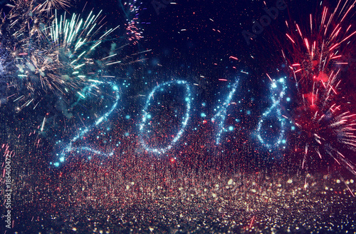 Happy New Years 2018 with glitter lights background. de-focused.