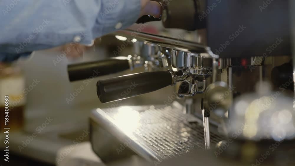 Barista's hands makes coffee in coffee maker. 4K Barista's hands makes coffee in coffee maker. 4K