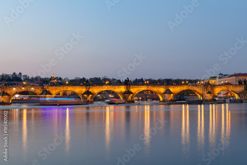 Scenic summer evening view of the Charles bridge over Vltava river in Prague, Czech Republic