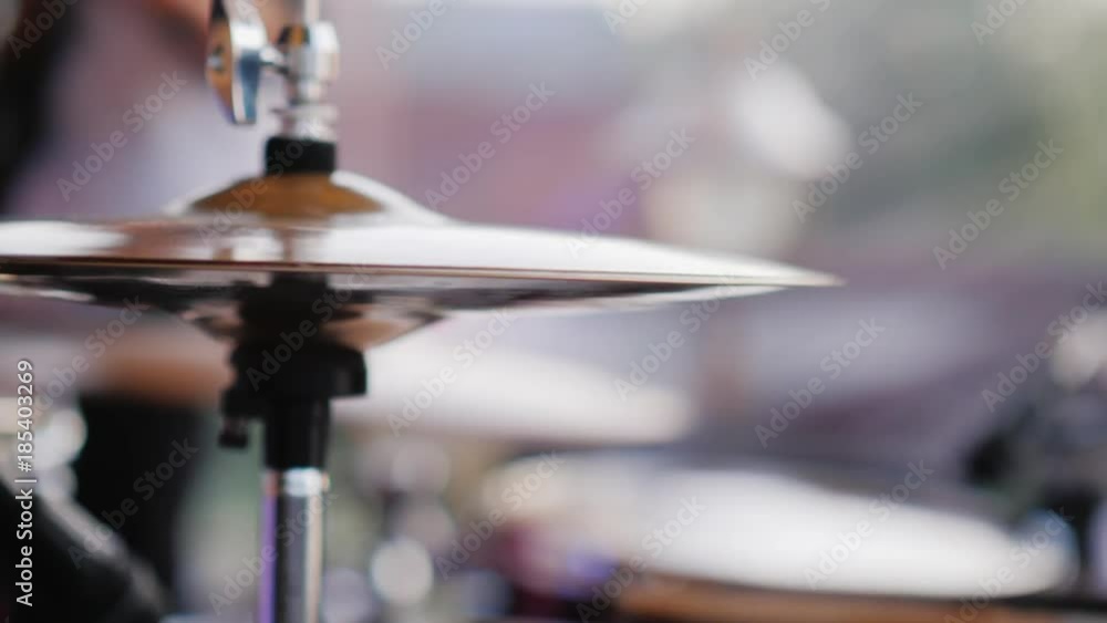 The drummer strikes with his chopsticks, close-up The drummer strikes with his chopsticks, close-up