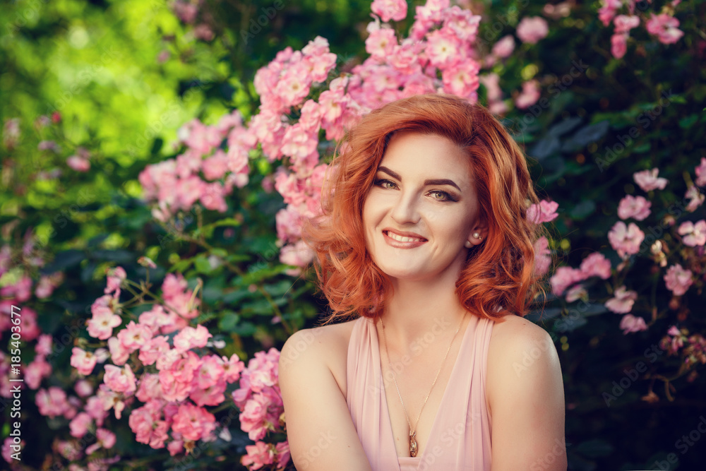 Fototapeta premium Lovely young woman in a pink dress, waiting for a date.