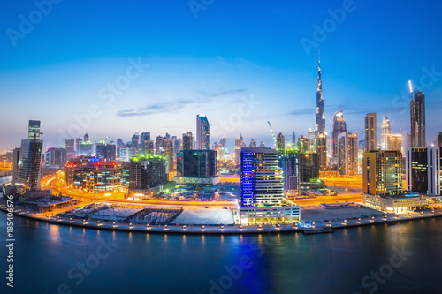 Dubai downtown and water canal with promenade after the sunset Dubai United Arab Emirates
