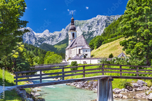 Scenic mountain landscape in the Bavarian Alps and famous Parish Church of St. Sebastian in the village of Ramsau in falltime, Nationalpark Berchtesgadener Land, upper Bavaria, Germany photo