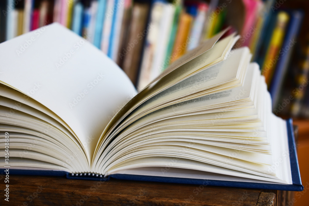 A open book in a library A open book in a library