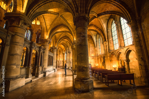 Long lightened corridor in Saint Remi abbey, Reims, France