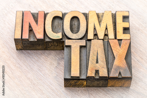income tax word abstract in wood type photo