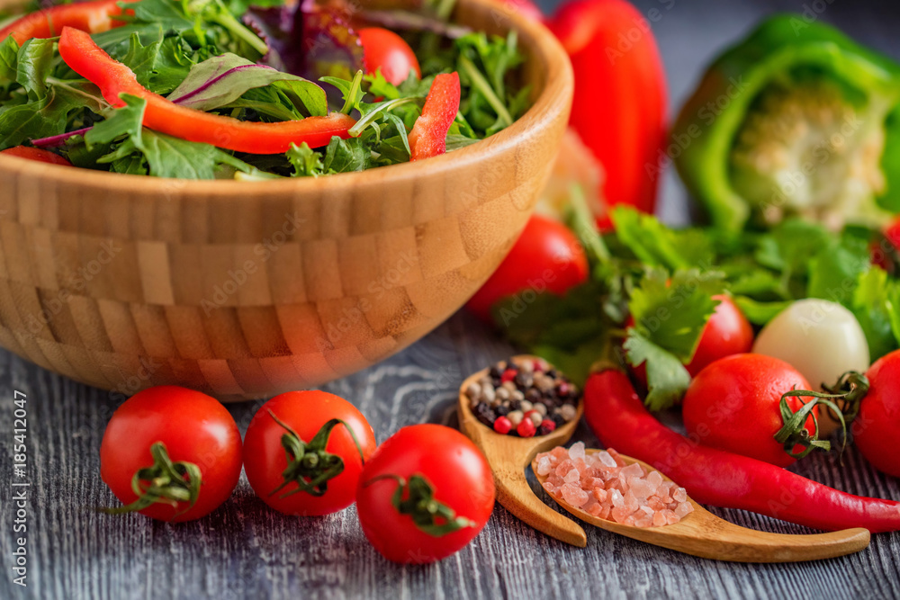 Fresh rustic vegetable salad on rustic background Fresh rustic vegetable salad on rustic background