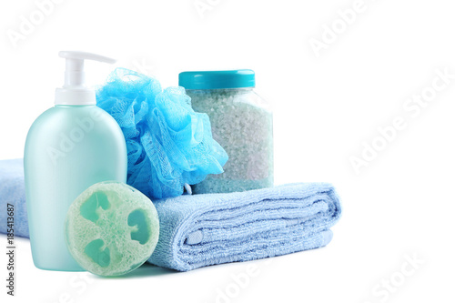 Towel with soap, wisp and bottle isolated on a white background