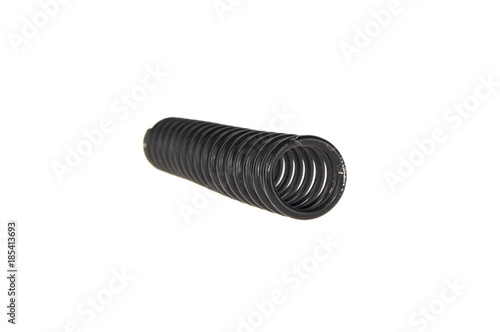 black old twisted spring on a white background