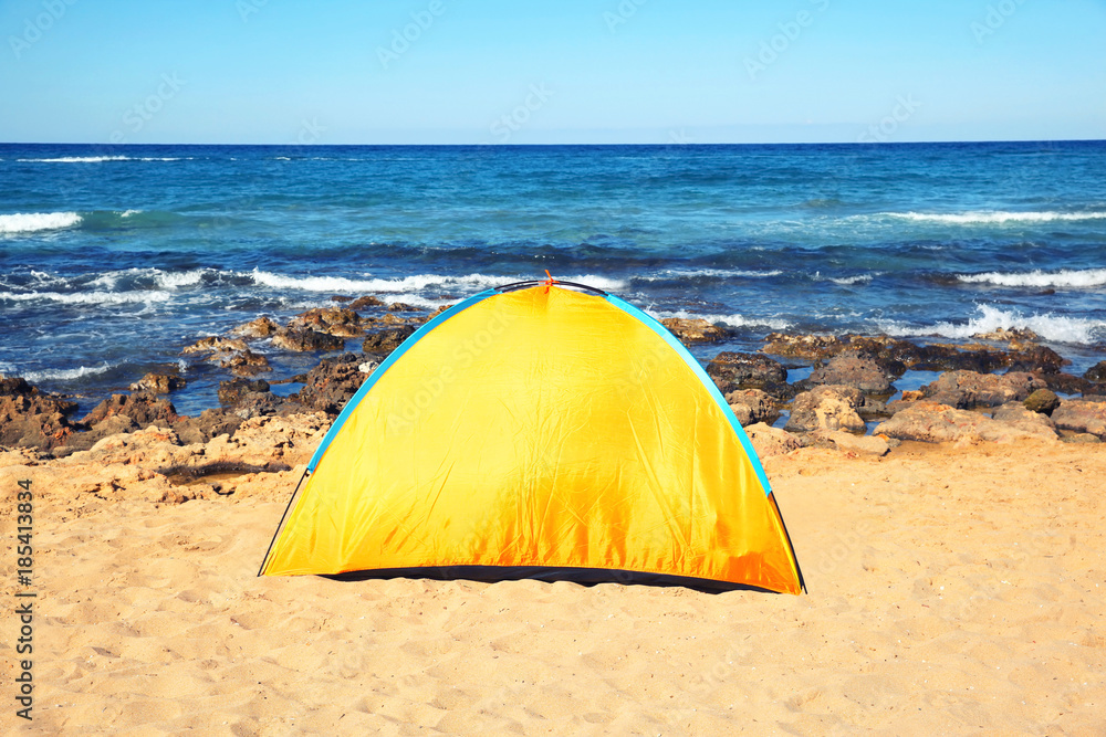 travel, tourism, hike concept - view sea camping tent on the beach