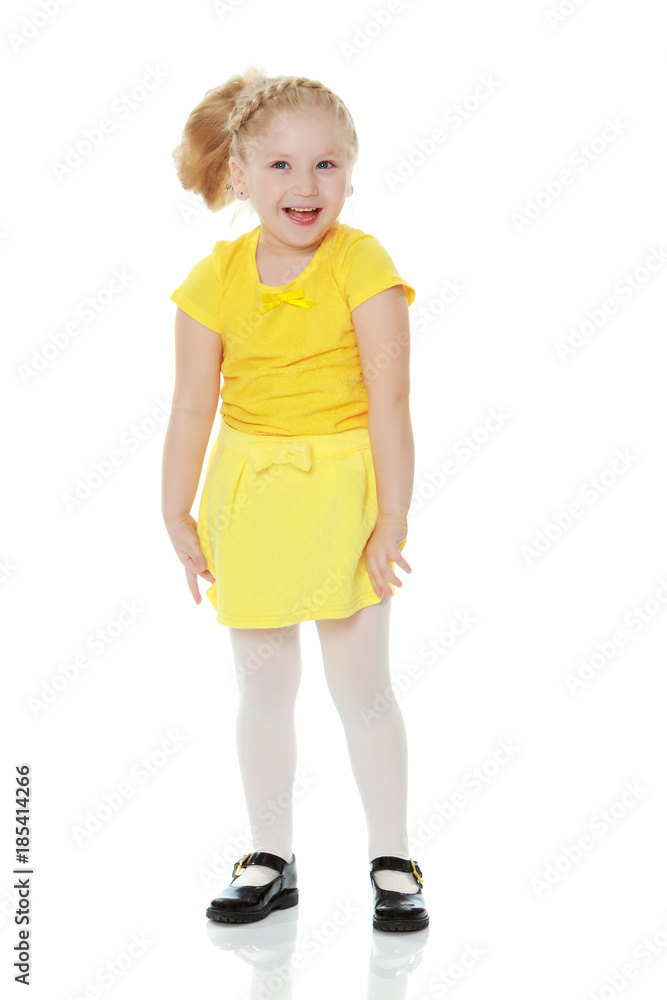 A little blonde in a yellow t-shirt. A little blonde in a yellow t-shirt.