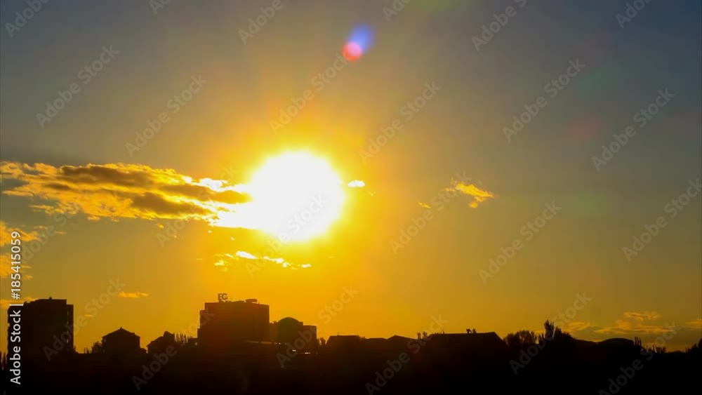 custom made wallpaper toronto digitalLovely Time Lapse of sunset, with big golden sun, with golden clouds, with lense flares, against the background of the city silhouette. The camera approach.