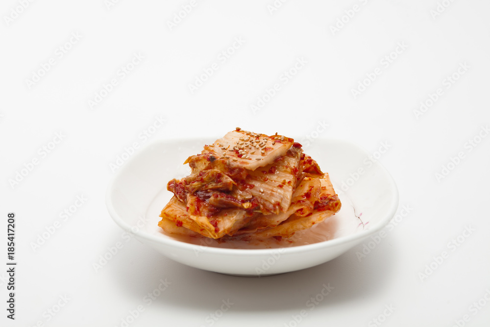 Kimchi on white dish isolated 