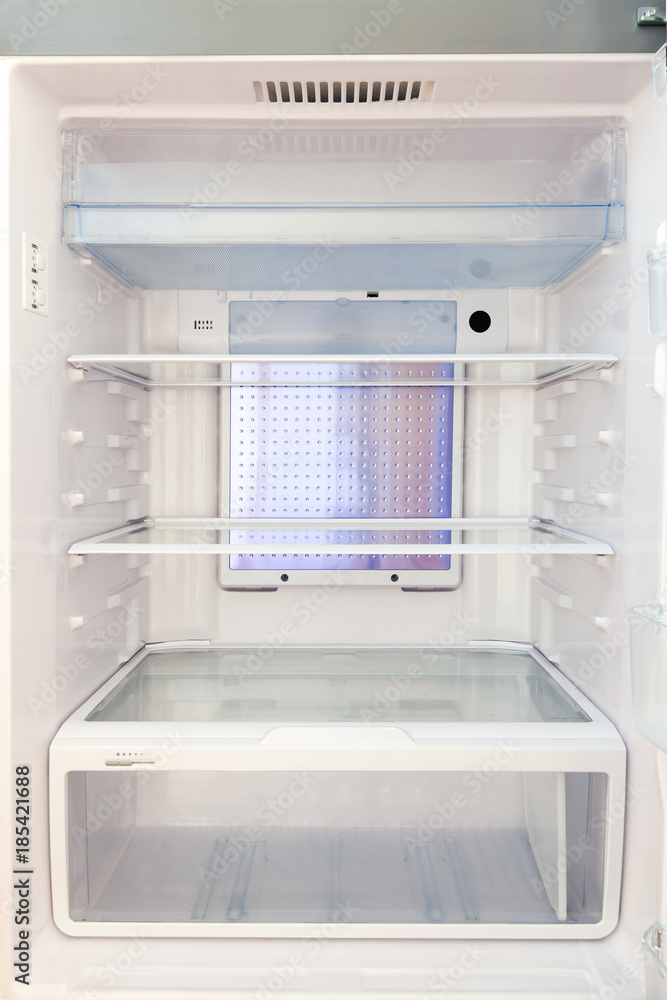 Refrigerator with empty shelves. Refrigerator with empty shelves.