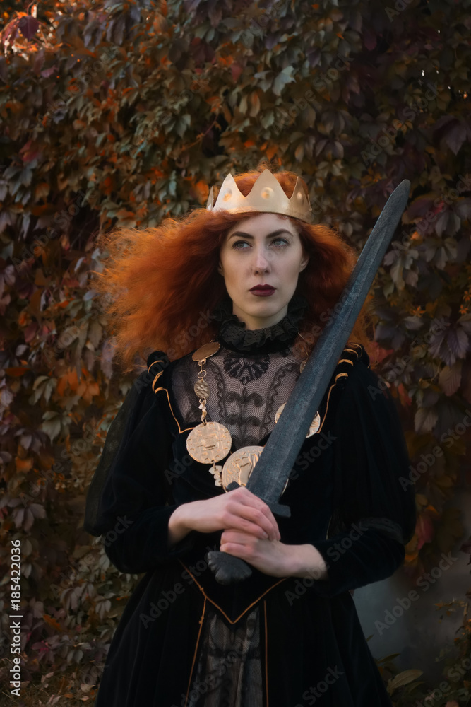 Naklejka premium Medieval Queen with a sword in her hand